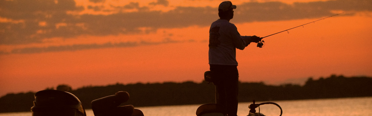 man fishing during sunset