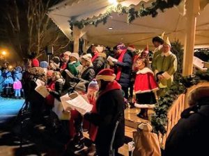 choir sings at the gazebo in the Waconia City Square park during the tree lighting ceremony