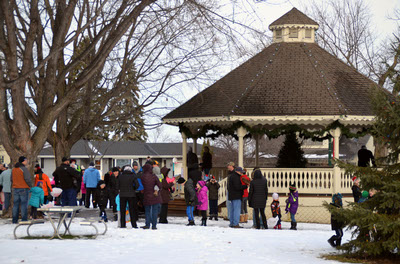 people gather in city square park in waconia in the winter