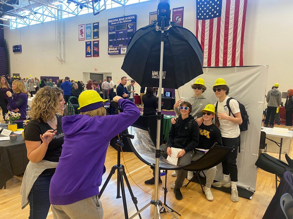 4 high schoolers pose for a photo at the waconia career expo