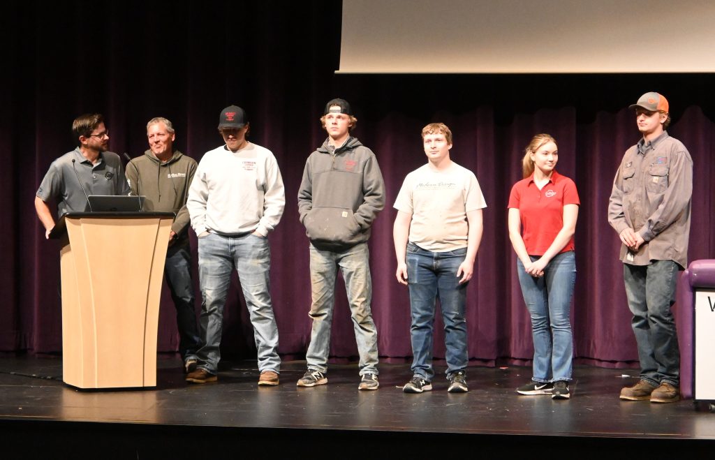 Speaker with five former Waconia Works Signing Day signees