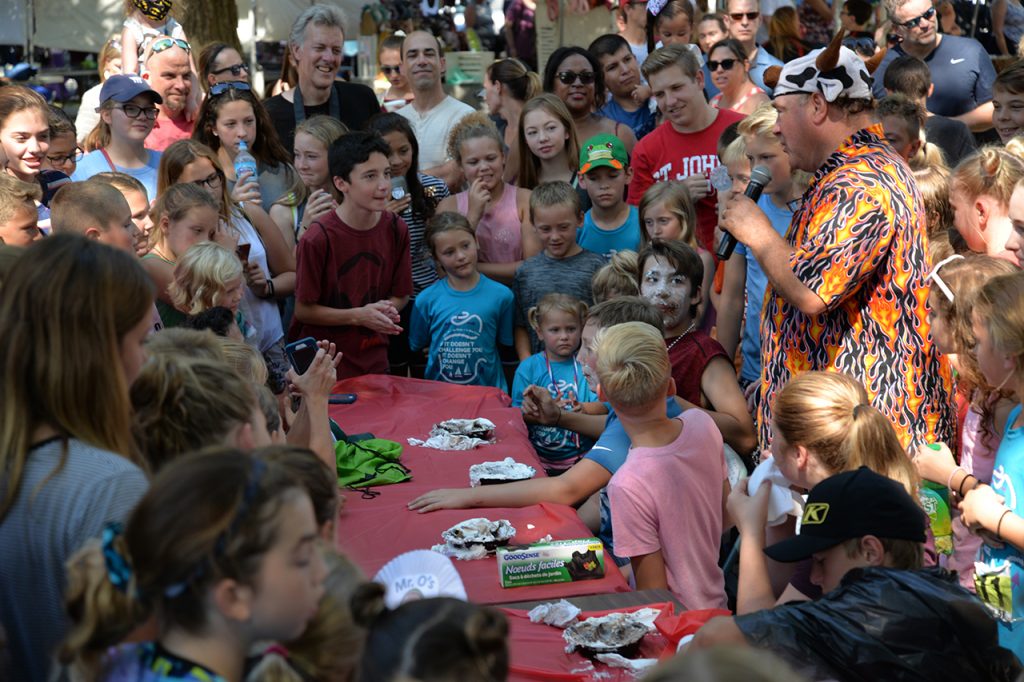 crowd surrounding pie eating contest